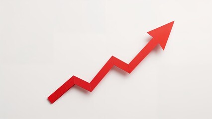 Red paper arrow symbolizing upward business trends on a plain white surface