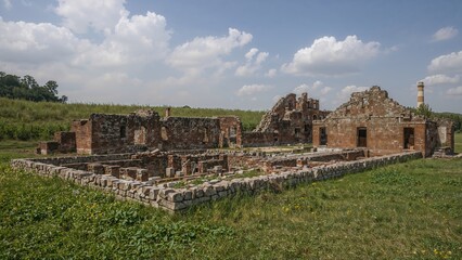 Derelict sugar processing plant with crumbling brick structures