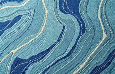 Abstract blue waves pattern on textured fabric background  