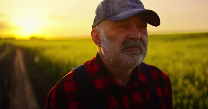 Sad Old Man Walking In Agricultural Fields After Hard Long Working Day, Closeup Portrait