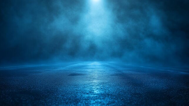 Mysterious empty road bathed in cool blue street lighting, heavy fog rolling across ground, pristine water reflections on glossy asphalt surface, dramatic light beams dispersing through atmospheric