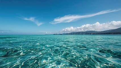 Vibrant blue waters under a clear sky in a coastal landscape