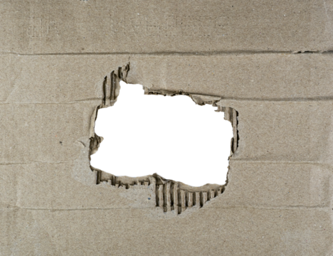 Torn cardboard piece with a circular hole in middle for text or graphics , isolated PNG