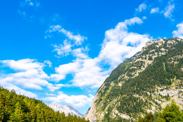 Alpine mountain and hill landscape panorama blue sky Salzburg Austria.