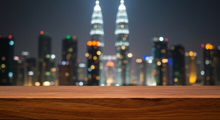 Teak wood surface with a blurred Kuala Lumpur cityscape backdrop at night