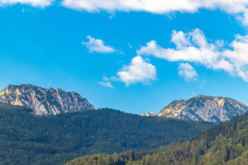 Alpine mountain and hill landscape panorama blue sky Salzburg Austria.