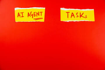 AI agent tasks written on yellow sticky notes isolated on red background