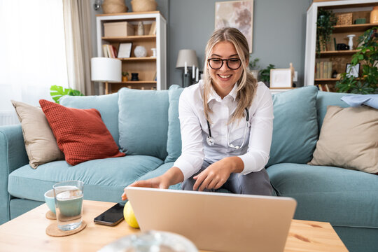 Telemedicine. Young woman doctor working at home office, private general practitioner, healthcare and medical female worker using laptop computer for contact with senior patients Helping people online