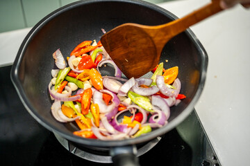 Culinary Skills cooking. Chef Expertly Stir-fries Vibrant Vegetables. Man mixing ingredient many vegetable.