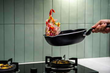 Culinary Skills cooking. Chef Expertly Stir-fries Vibrant Vegetables. Man mixing ingredient many vegetable.