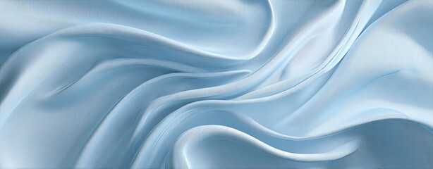 Fototapeta premium Light blue silk fabric with flowing drapes