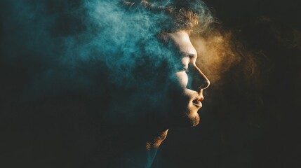 Side profile portrait of man surrounded by dramatic moody smoke for cinematic surreal conceptual photography