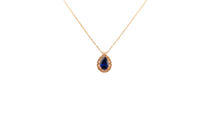 Elegant gold necklace with a teardrop sapphire pendant, isolated on transparent background.