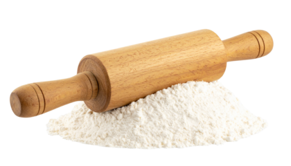 Wooden rolling pin resting on a pile of flour against a isolated on transparent background