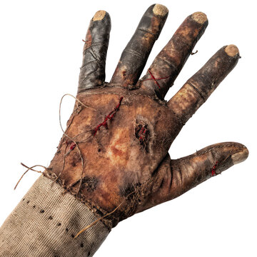 Zombie Hand: A gruesome close-up reveals the decaying hand of a zombie, its decaying flesh stitched together with visible sutures, evoking a sense of horror and dread.