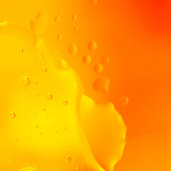 Bright Orange Yellow Macro Bubbles. Macro abstract photo of liquid bubbles in vibrant orange and yellow gradient tones