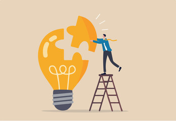 Solve business problem with creativity, finishing or complete brilliant idea, work solution or business idea concept, smart businessman assemble last piece of jigsaw to complete lightbulb idea puzzle.