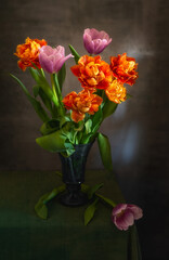 A beautiful bouquet of tulips on a dark background.