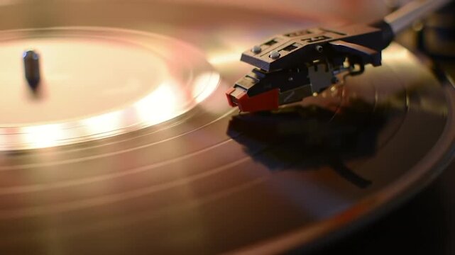 Vinyl Record Spinning on Turntable with Stylus Arm in Motion, Close-up View