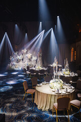 Elegant ballroom set for a formal event with exquisite floral decor