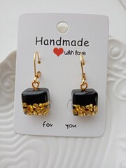 Black handmade earrings with gold stones