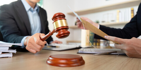 Legal Proceedings. Lawyer using gavel in office.