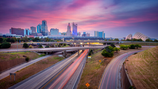 Kansas City, Missouri, USA. Panoramic cityscape image of Kansas City skyline with busy highway leading to the city at autumn sunrise. - Powered by Adobe