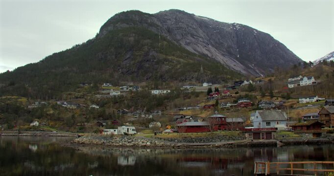 Shot looking across the river Elo to houses in Eldfjord with Vindoksal in background.