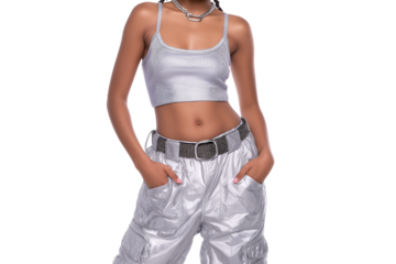 Stylish woman poses confidently in silver metallic attire isolated on white background