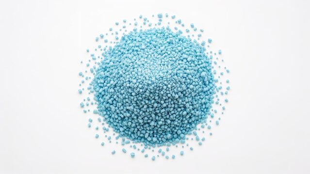 Blue-colored masterbatch granules shown against white backdrop, utilized as a plastic coloring component
