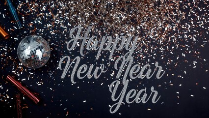 Festive flat lay featuring a glowing disco ball, party blowers, glittering confetti, and twinkling lights for the New Year