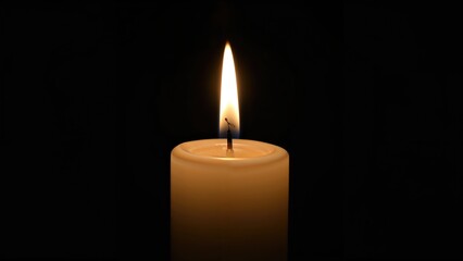 A luminous candle flame flickering on a white candle in a dark environment.
