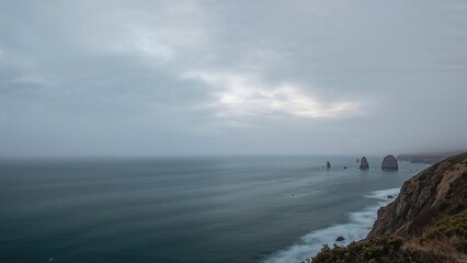 Overcast twilight in spring along the western shoreline, long-exposure wide shot