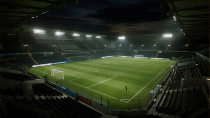 Empty soccer stadium with bright green field and stadium lights at night