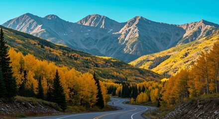 Winding road through a mountain valley with colorful autumn foliage. Scenic landscape and nature travel concept. Perfect for scenic road trip advertisement.