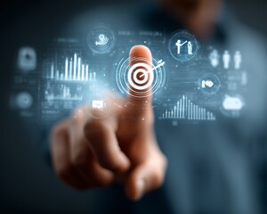 Digital interface with graphs and icons; a hand reaching towards a target symbol.