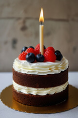 Delightful Chocolate Cake with Whipped Cream, Fresh Berries, and a Lit Candle