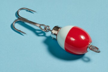Colorful fishing bobber on a blue background showcasing a detailed design for anglers