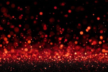 Sparkling red particles create a mesmerizing effect against a dark backdrop during a festive celebration at night