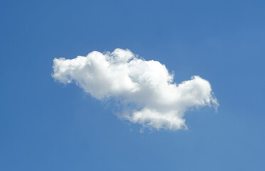 A small white cloud in the blue sky