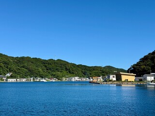 Seaside scenery of Naru Island, Goto Islands, Nagasaki, Japan – traditional houses, canal, and...