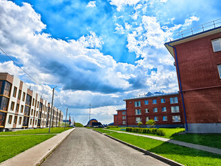 Bright afternoon with blue skies over residential street in a modern neighborhood