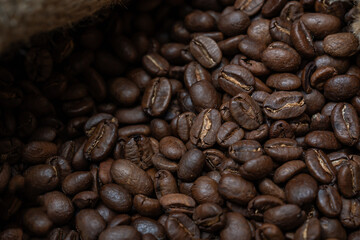 Close-up image of a coffee bean bag filled with coffee beans.