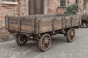 Old wooden cart on cobblestone street in historic village showcasing rustic craftsmanship and timeless design