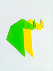 Green and yellow swan origami isolated on white background.