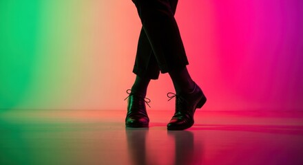 Legs in motion, dancing under vibrant green and magenta studio lighting