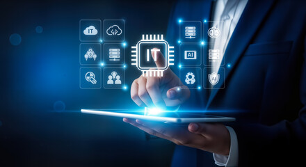 A person in a suit touches a digital interface displaying it icons and a central chip, symbolizing digital transformation and technological advancement in business operations