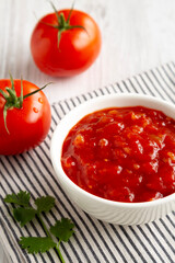 Organic Tomato and Cilantro Salsa in a Bowl, side view.
