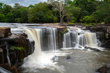 Beautiful waterfall, violent stream in the deep forest.Tropical waterfall Tadtone in climate forest, Chaiyaphum Province in Northeast thailand.