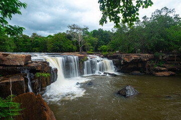 Beautiful waterfall, violent stream in the deep forest.Tropical waterfall Tadtone in climate forest, Chaiyaphum Province in Northeast thailand.